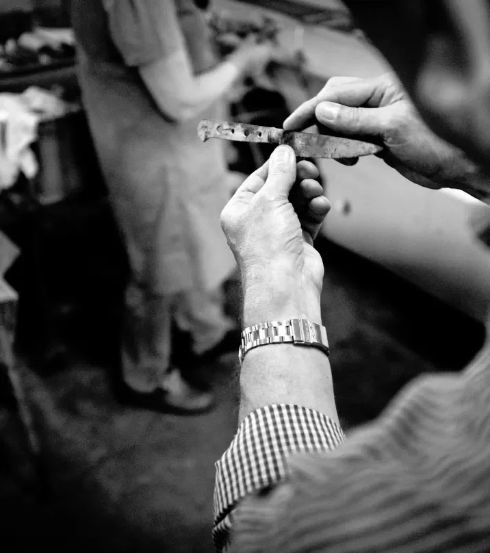 A craftsperson assembling a Lion Sabatier knife handle