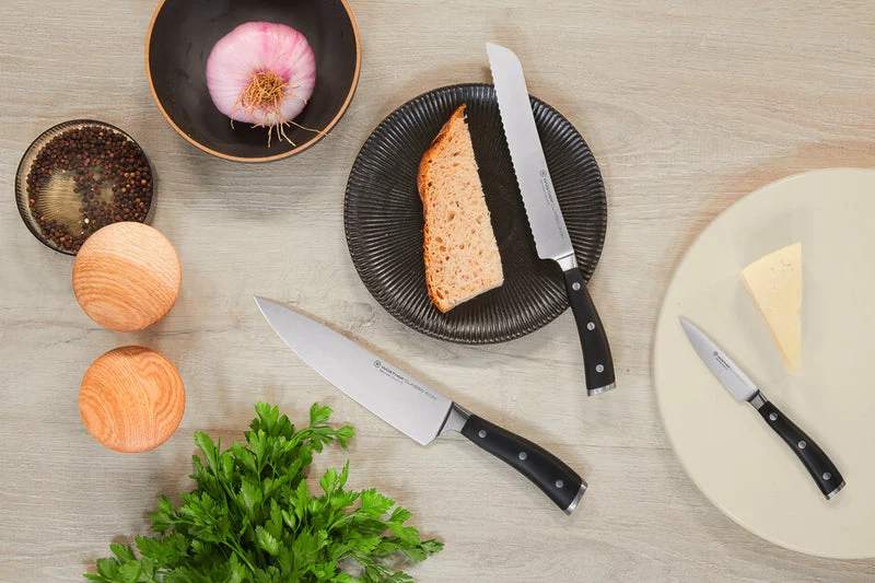 Wüsthof Classic Ikon knives arranged with kitchen ingredients