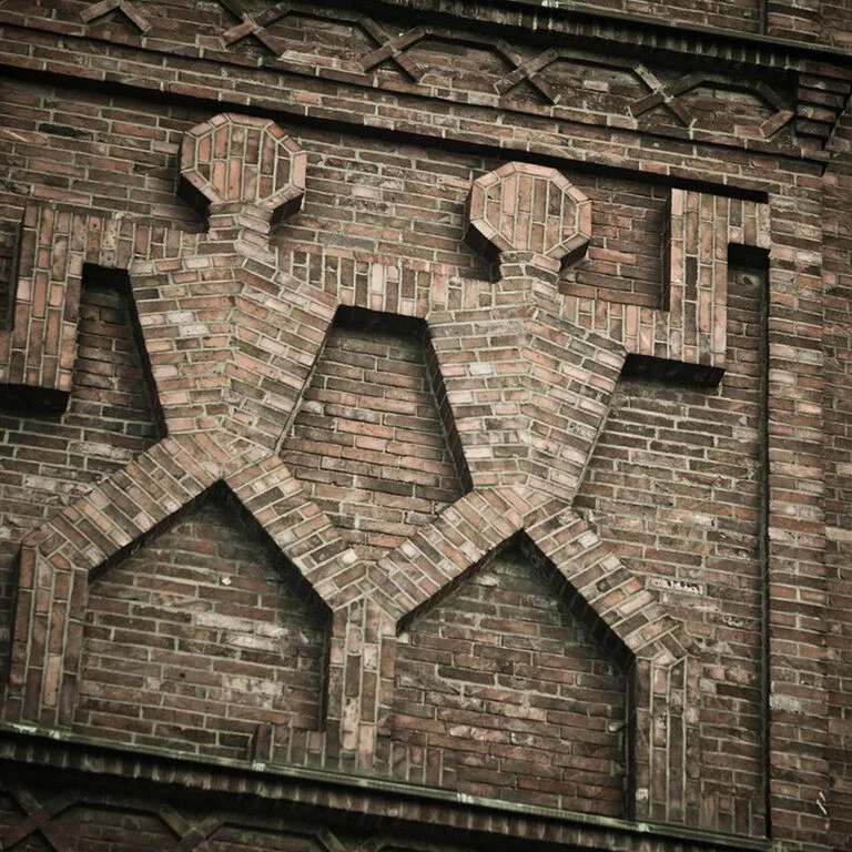 The ZWILLING twin symbol on historic brick architecture
